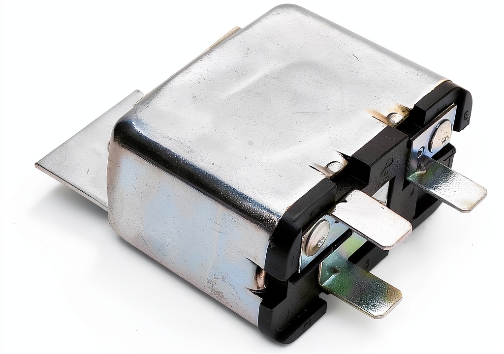 Installing PartCatalog Silver Alloy Normally Open Relay on a wooden bench with wiring tools